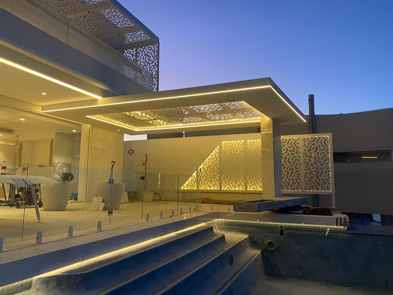 House White, Fresnaye — pool terrace at dusk.